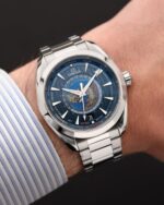 Omega Aqua Tera world timer watch on a man's writst