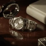 Rolex watch on a wooden table with watch tools