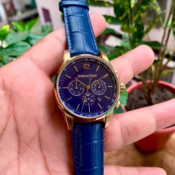 Audemars Piguet Code 11.59 style men’s watch with blue dial, open-heart design, rosegold case, and leather strap