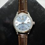 Grand Seiko SBGM253G GMT men’s automatic watch with sky-blue dial, Caliber 9S66 movement, and 72-hour power reserve.
