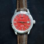 Grand Seiko Hi-Beat 36000 GMT men’s automatic watch with autumn red dial, 39.5mm case, dual time, and Caliber 9S86 movement.