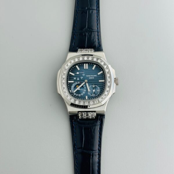 First Copy Patek Philippe Nautilus 5712 Silver Blue Dial Men’s Watch featuring 24-hour time, date indicator, sapphire crystal, stainless steel case, and automatic movement with open-back design.