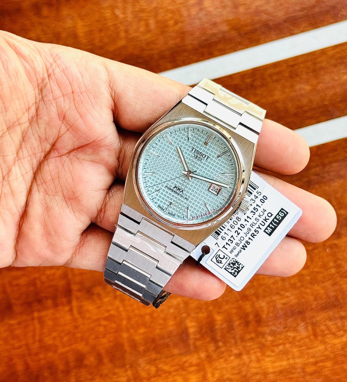 Tissot PRX Automatic for Men with Tiffany Blue & Black dial, stainless steel bracelet, and automatic movement.